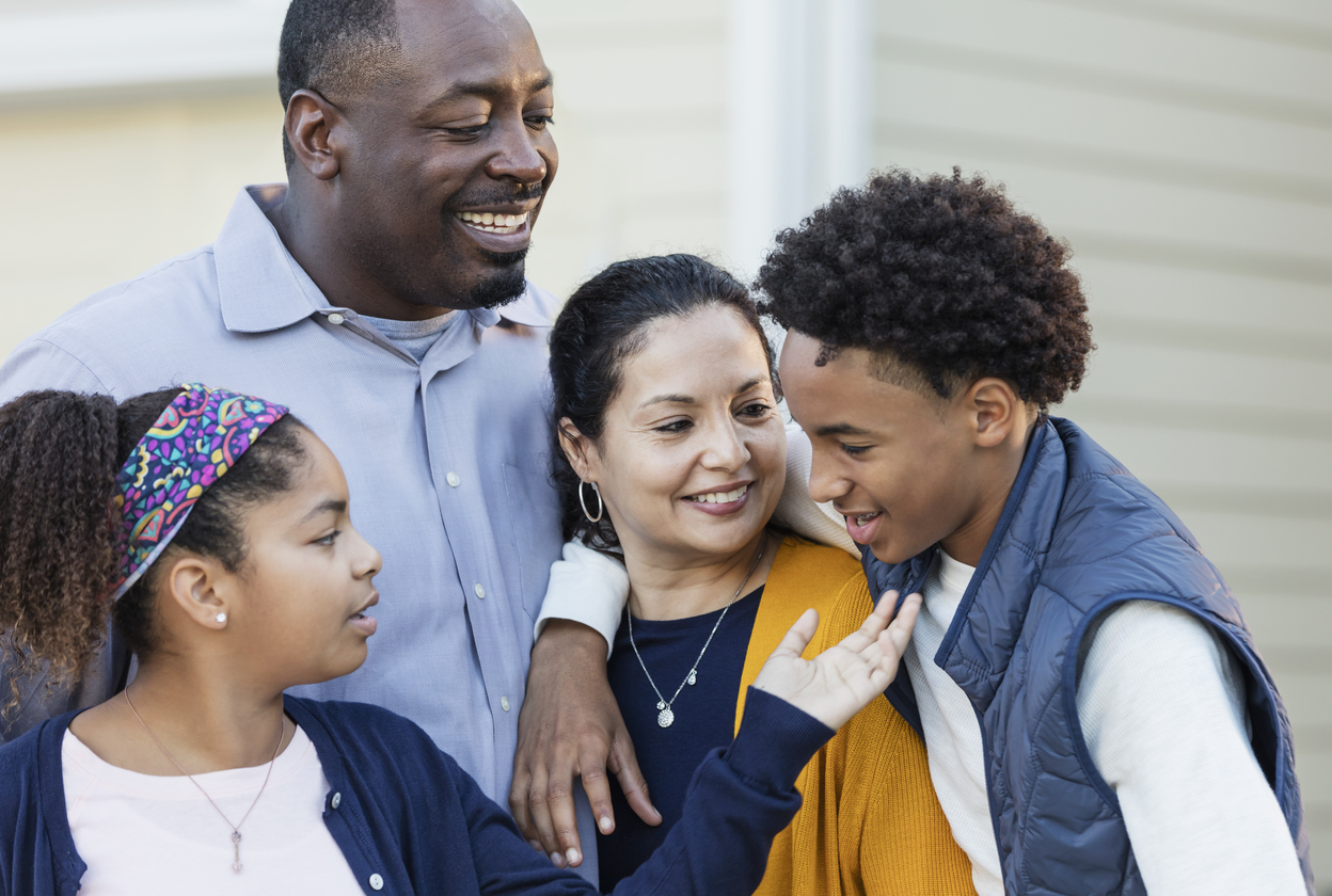 happy family with teen and preteen